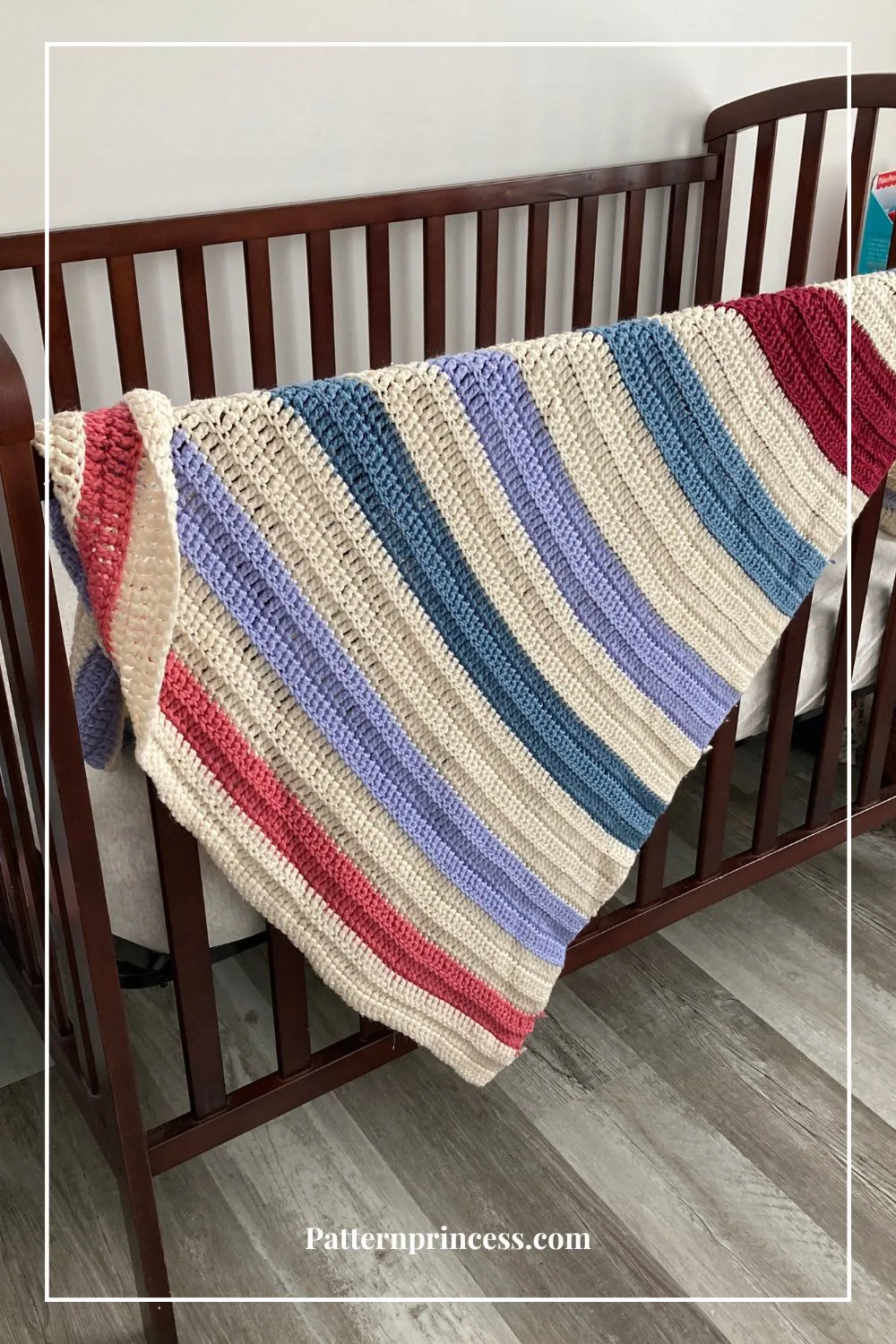 Scrappy Baby Blanket on the side of a crib