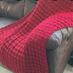 Shell Stitch Afghan on brown sofa