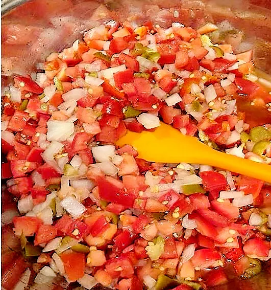 Mixing Fresh Tomato Salsa Ingredients in Large Bowl