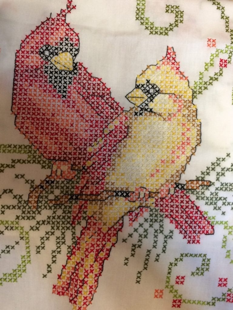 close up of cardinal cross stitch