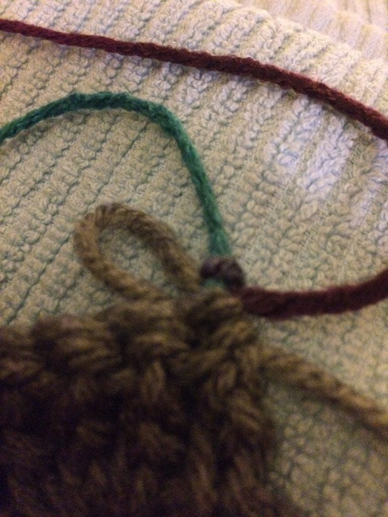 step two in changing color yarn