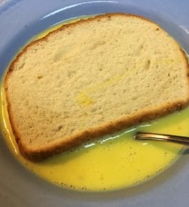 dipping bread in egg mixture