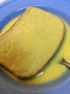 coating bread with egg mixture