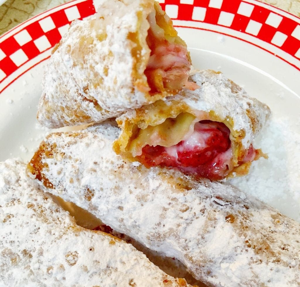 Strawberry cream cheese egg rolls cut in half