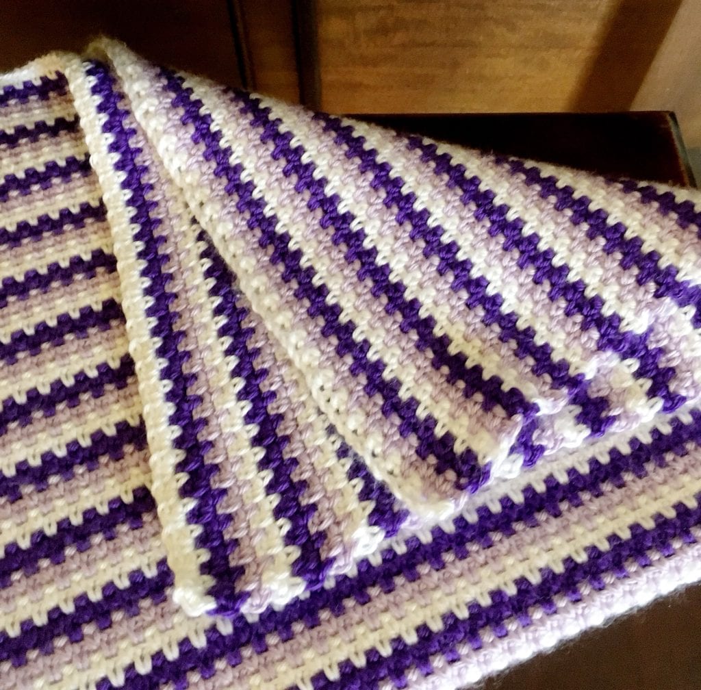 How to crochet a moss stitch baby afghan folded
