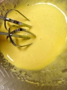 mixing egg yolks for key lime pie