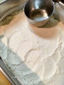 Patting the shortbread crust into the pan