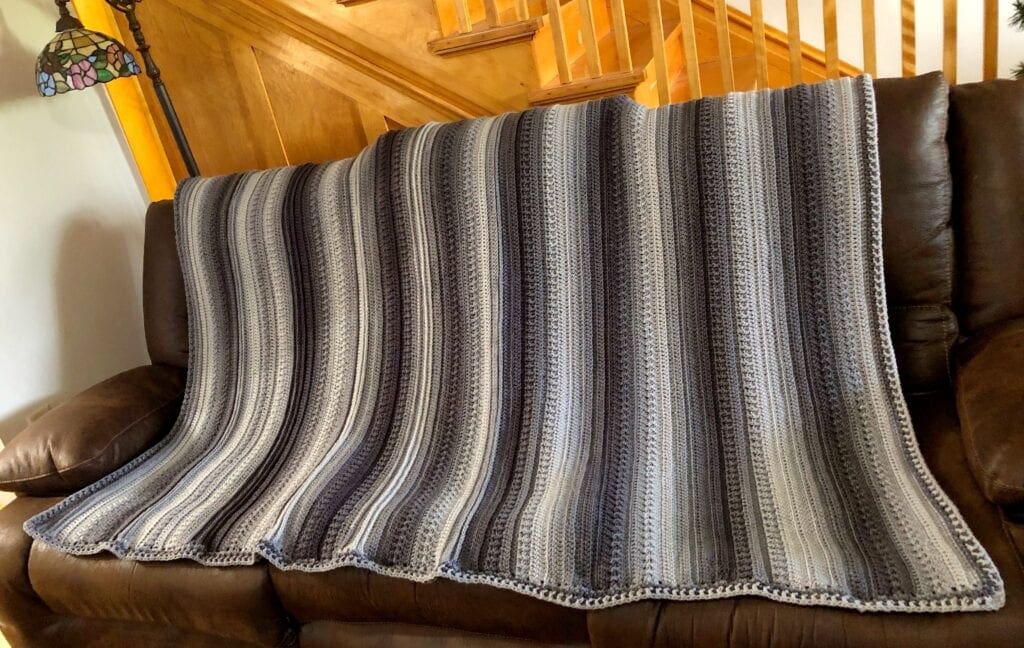 Textured Ombre Crochet Blanket Displayed on Sofa