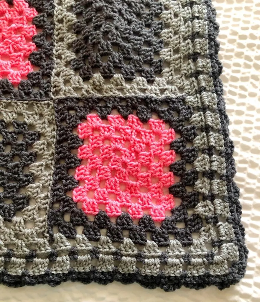 Close-up showing the detail of the simple loop granny square crochet blanket