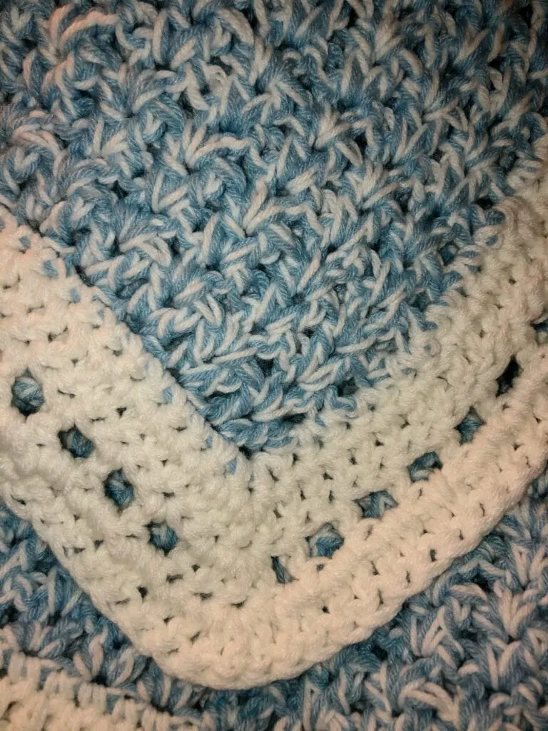 Crochet V-Stitch Blanket with White Yarn for the Last Round