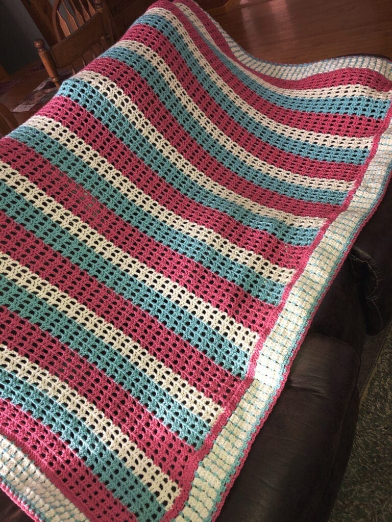 Thinking of Spring Crochet Afghan Over a Sofa