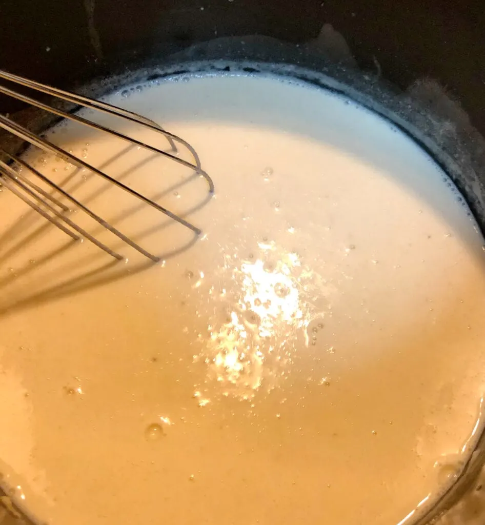 Incorporating Milk into the Flour and Butter. Making a Roux.