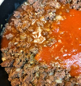 Add Tomato Sauce to Ground Beef Mixture