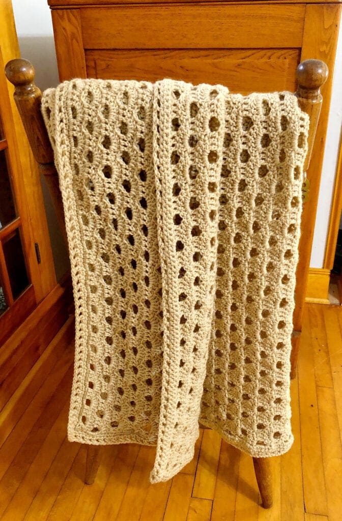 Crochet Shell Blanket Folded Over Chair