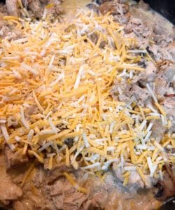 Adding Shredded cheese to the Skillet