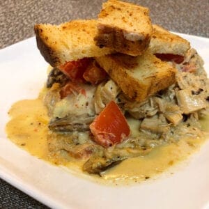 Creamy Skillet Chicken Served with Mashed Potatoes and Homemade Garlic Bread