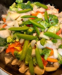 Adding Pea Pods to Skillet