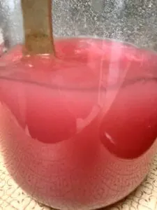 Mixing Lemonade Ingredients in Glass Gallon Jar