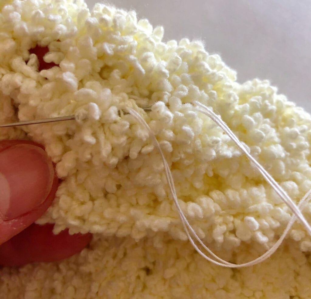 Working on the Underside of the Crochet Covering Secure the Thread