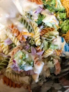 Adding Salad Dressing to the Broccoli Pasta Salad