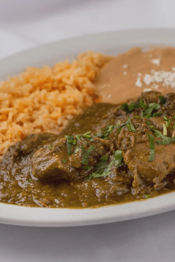 Pork Chile Verde Served with Rice and Homemade Beans