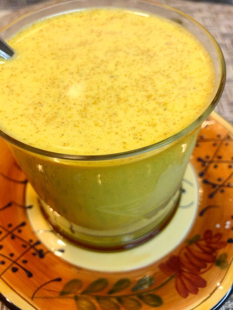 Turmeric Tea Drink in Glass Coffee Cup