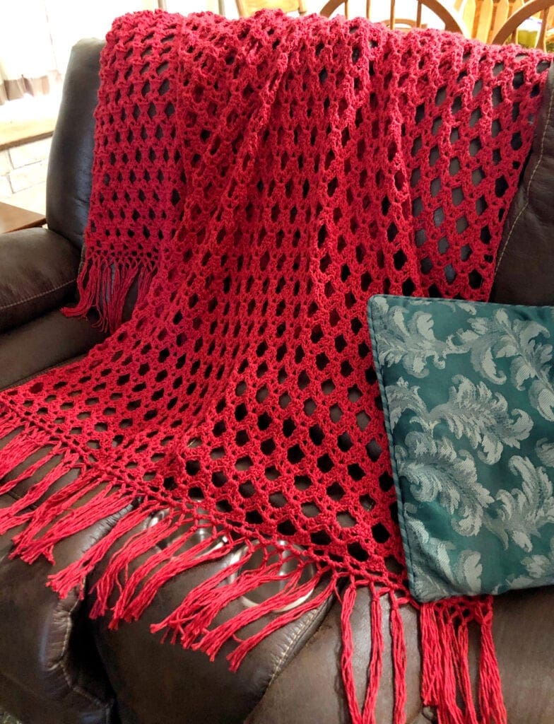 Lacy Crochet Blanket Displayed on Sofa