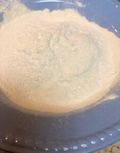 Adding Pancake Mix to the Shallow Bowl