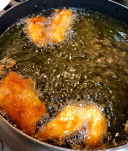 Frying Battered Fish in Oil in Skillet