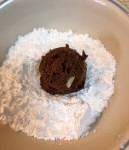 Rolling Cookie Dough in Powdered Sugar