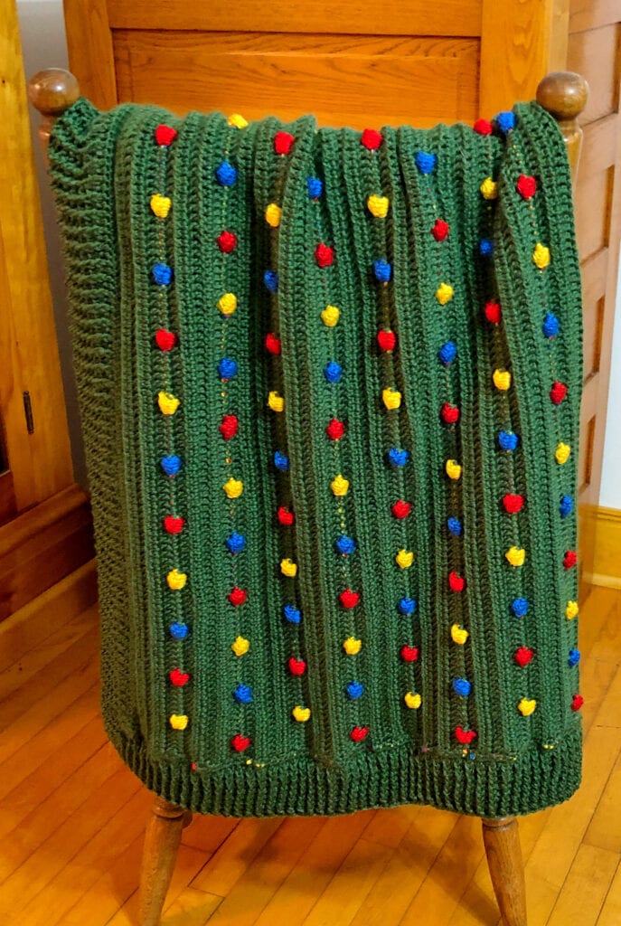 Textured Bobble Blanket Folded on the Back of a Chair