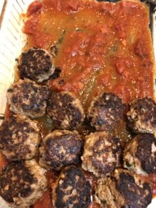 Adding Meatballs to 9 X 13 Pan Spread with Marinara Sauce