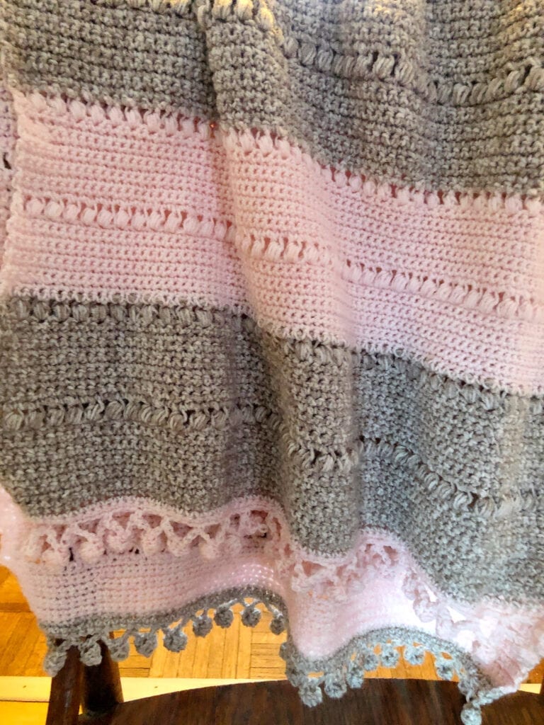 Crochet Shawl Wrap Hanging Over the Back of a Chair