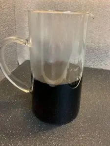 Homemade Grenadine Syrup in a Pitcher