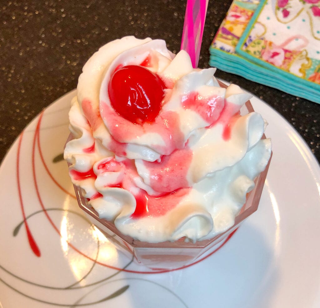 Ice Cream Drink Topped with a Maraschino Cherry
