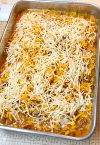 Sprinkle Shredded Cheese on top of the Casserole