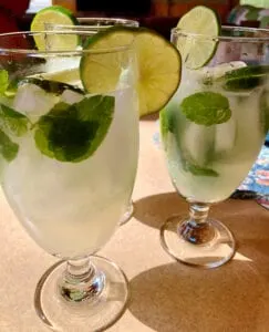 Authentic Mojitos Garnished with Fresh Mint and Lime Slices