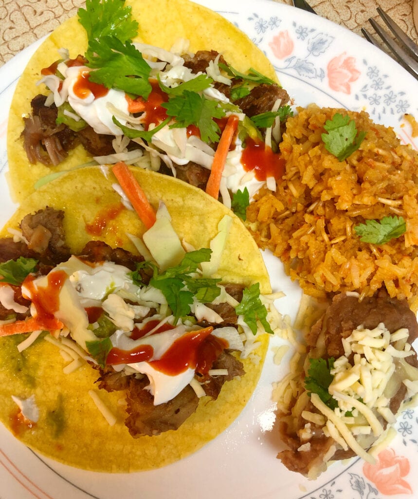 Pork Carnitas with Refried Beans and Spanish Rice