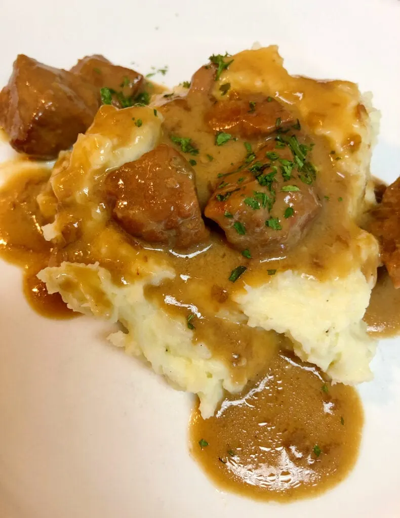 Tender Beef Tips and Gravy Over Mashed Potatoes