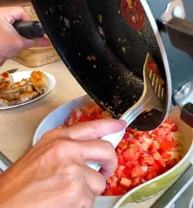 Adding Tomato Mixture to Pasta