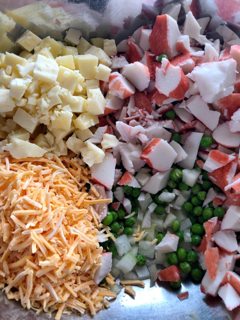Imitation Crab Salad Ingredients in Mixing Bowl