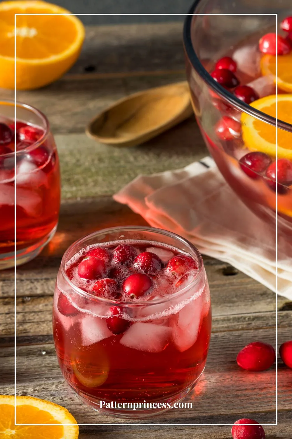 Punch garnished with orange slices and whole cranberries