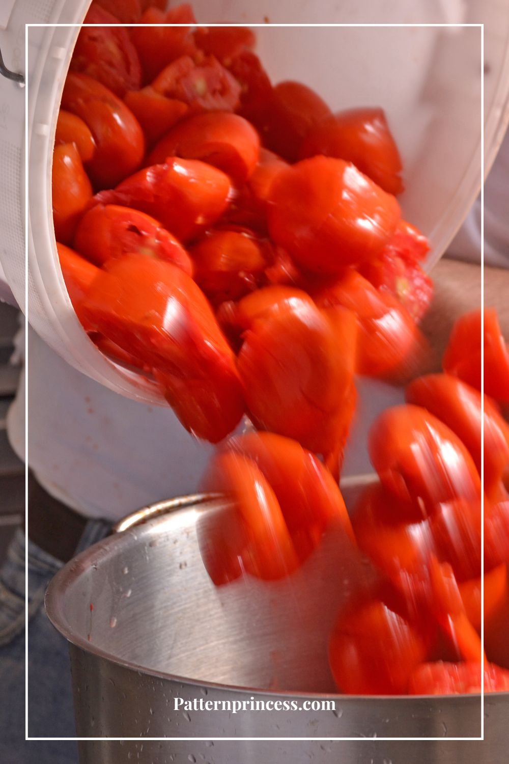 adding quartered tomatoes to large pot