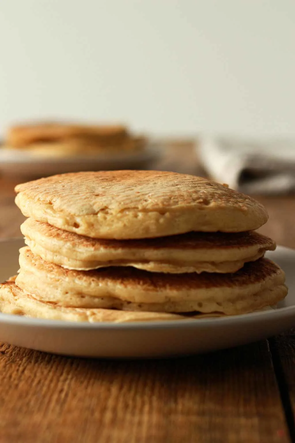 stack-of-4-pancakes-on-a-white-plate