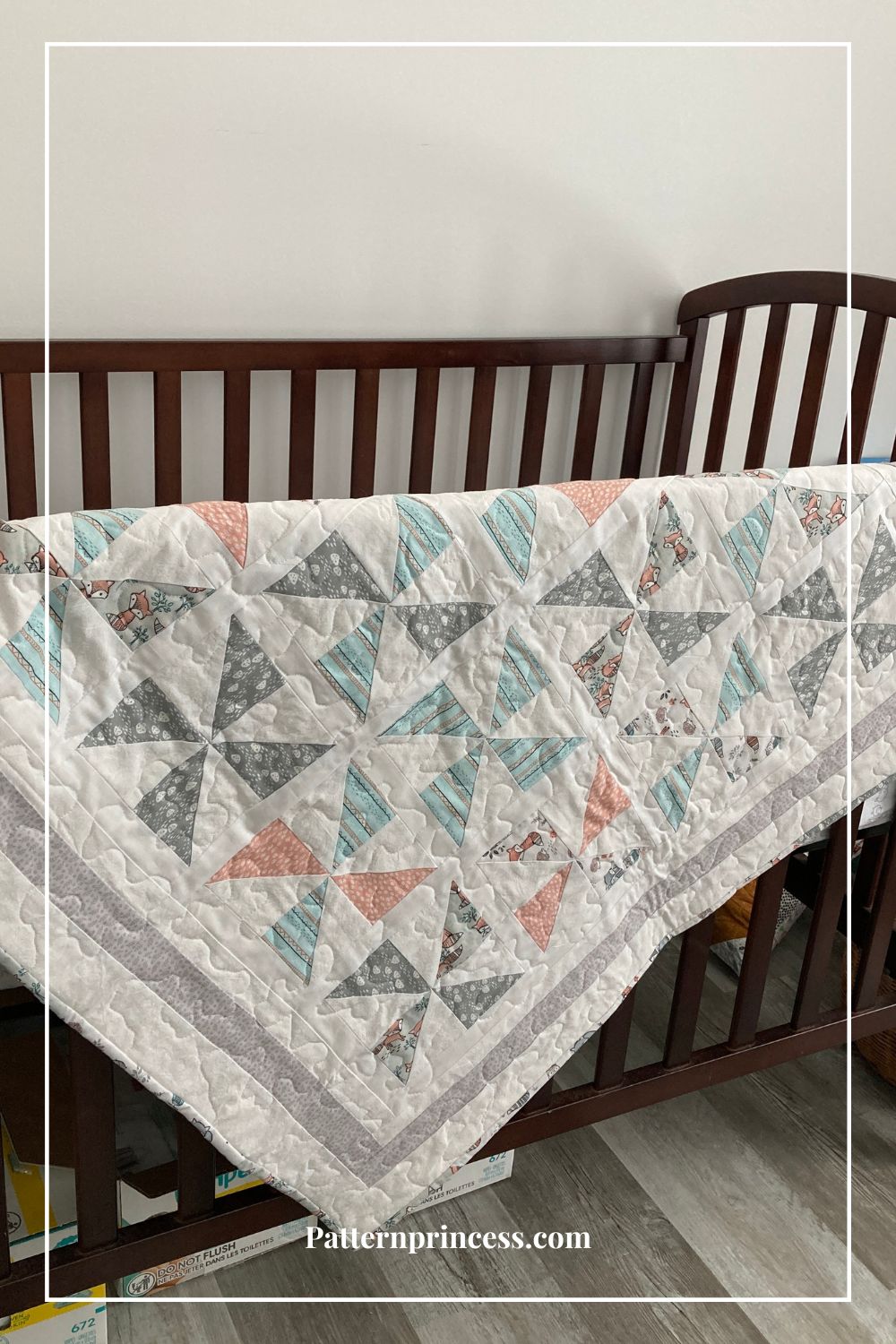 Charleston baby quilt over crib railing