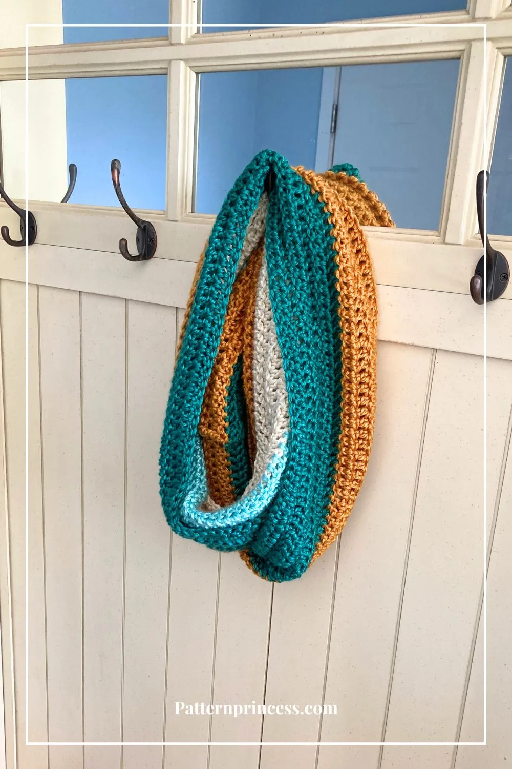 Easy Scarf with Bold Colors Hanging on Coat Hook