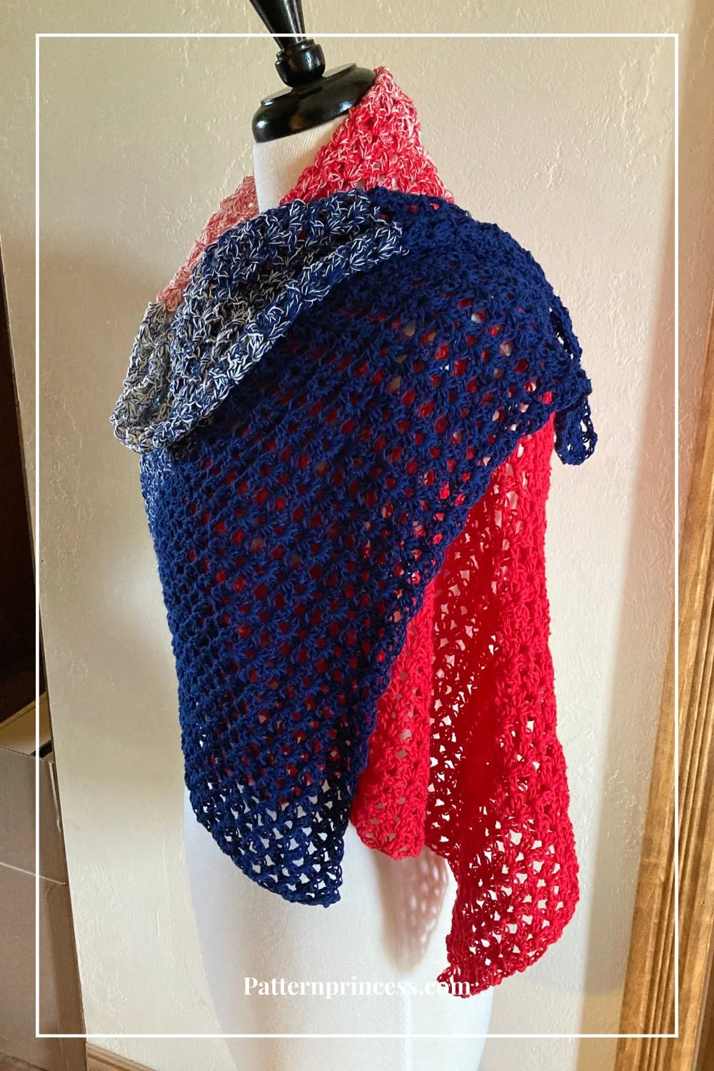rectangular shawl draped over one shoulder