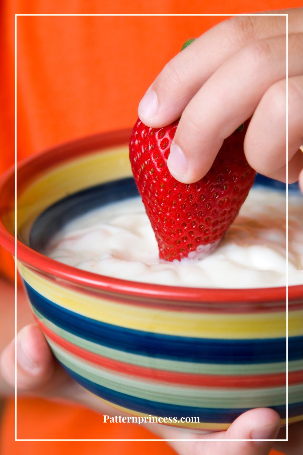 Dipping Fresh Strawberry in Creamy Fruit Dip